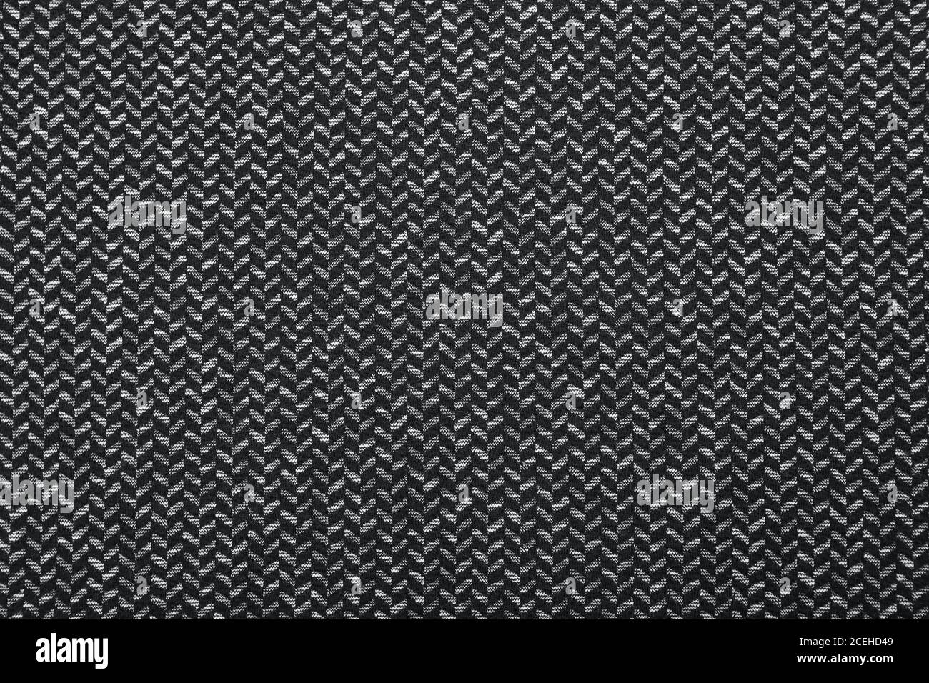 Black and white herringbone fabric pattern texture background closeup Stock Photo