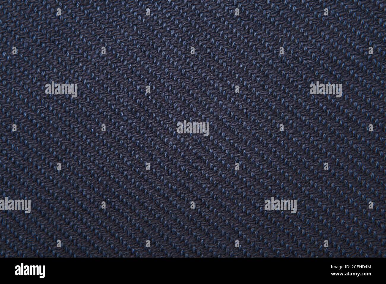 navy twill weave fabric pattern texture background closeup Stock Photo