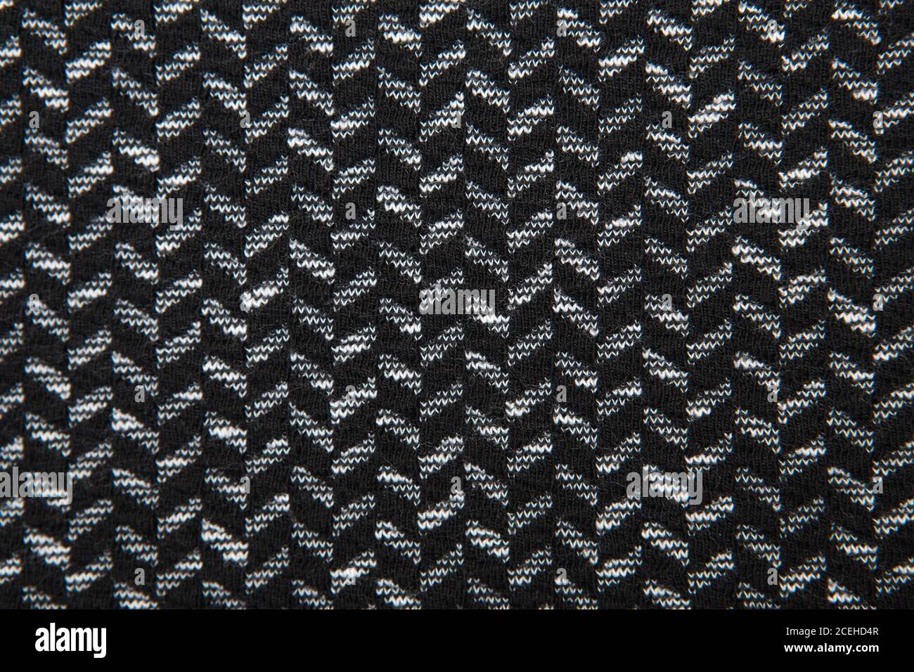 Black and white herringbone fabric pattern texture background closeup Stock Photo