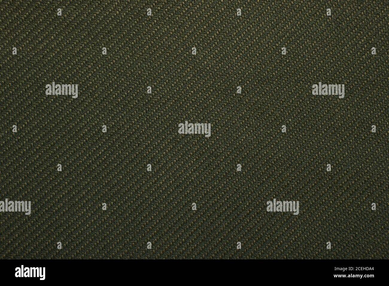 green twill weave fabric pattern texture background closeup Stock Photo