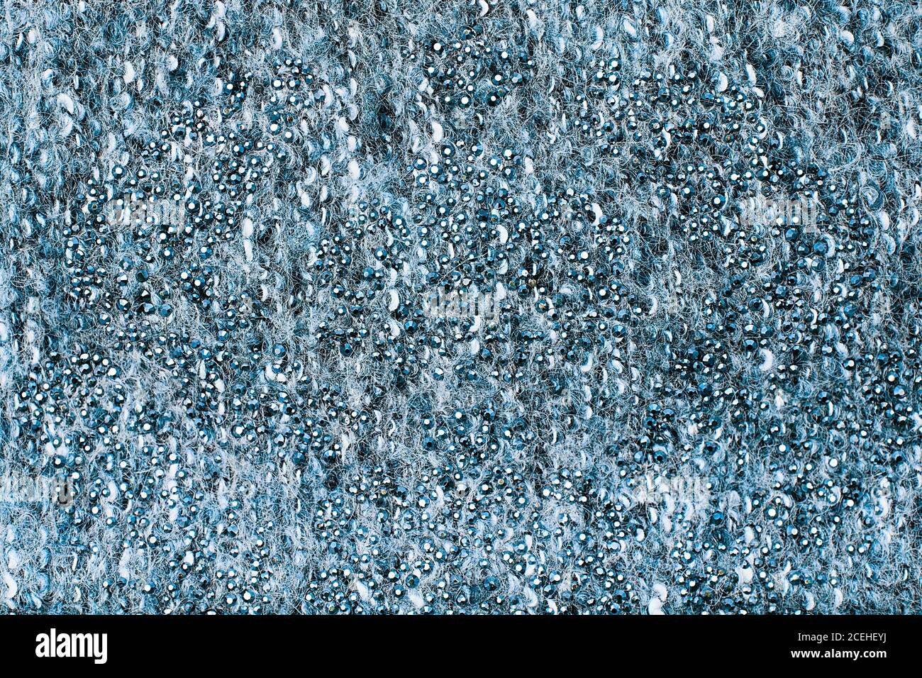 Close-up of mohair fabric textured cloth background. Blue knitted