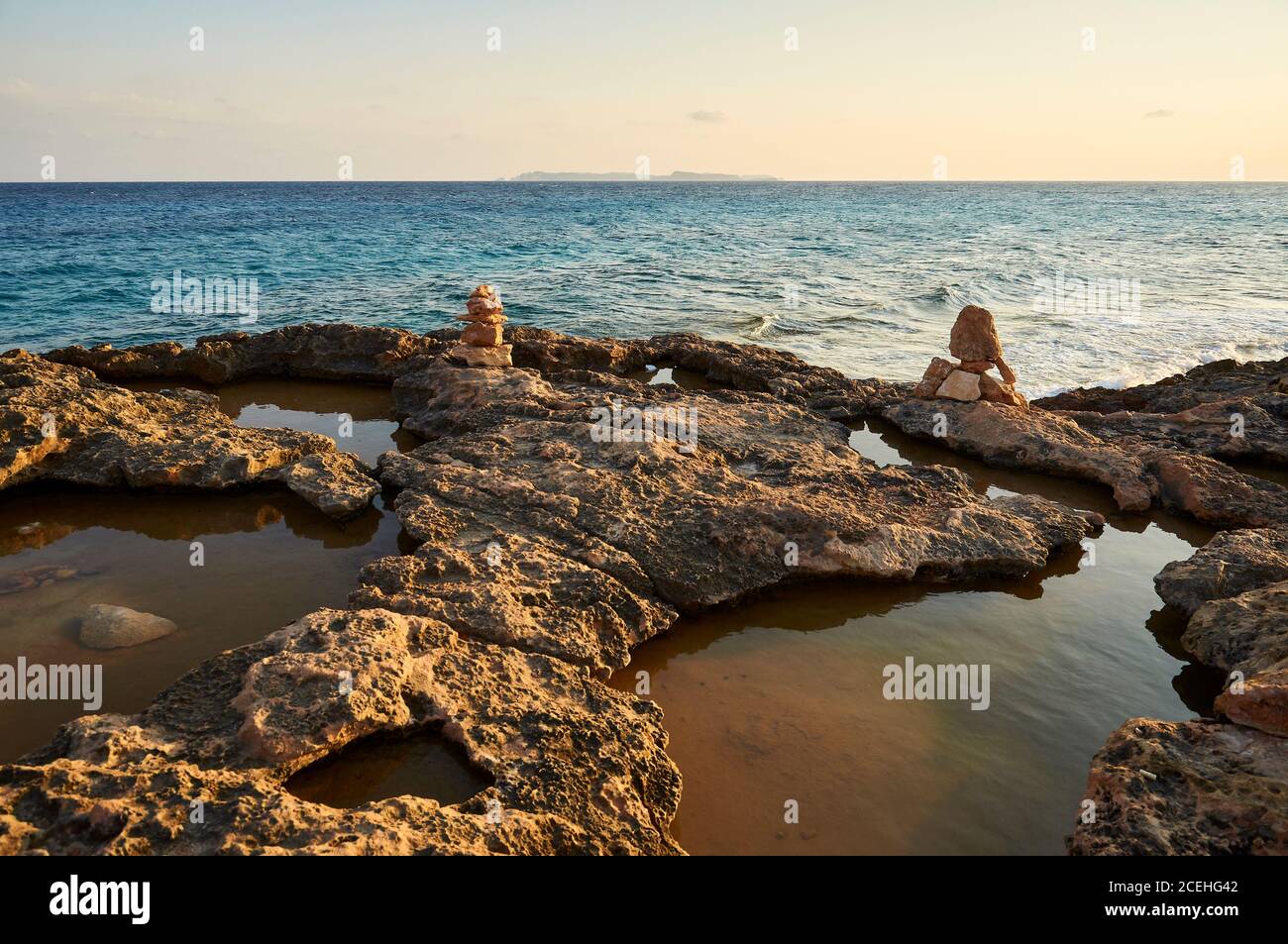 Sundown at Cap de Ses Salines coastline with Cabrera Archipelago in the distance (Santanyí, Majorca, Balearic Islands, Mediterranean sea, Spain) Stock Photo