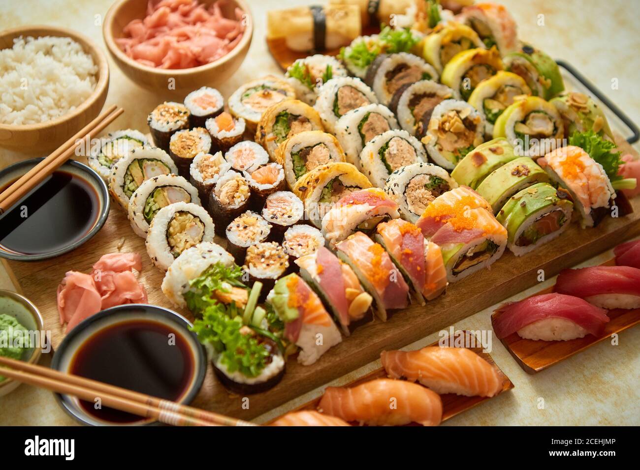 Above view of various sushi and rolls placed on board. Japanese food fest Stock Photo - Alamy