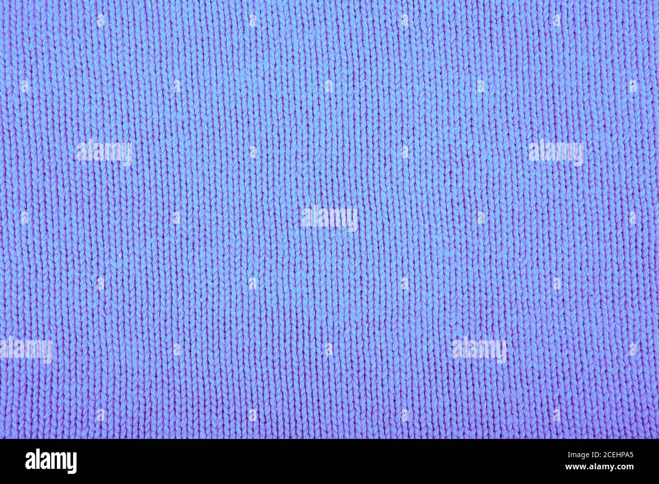 Wool sweater texture close up. Knitted jersey background with a relief pattern. Braids in machine knitting pattern Stock Photo