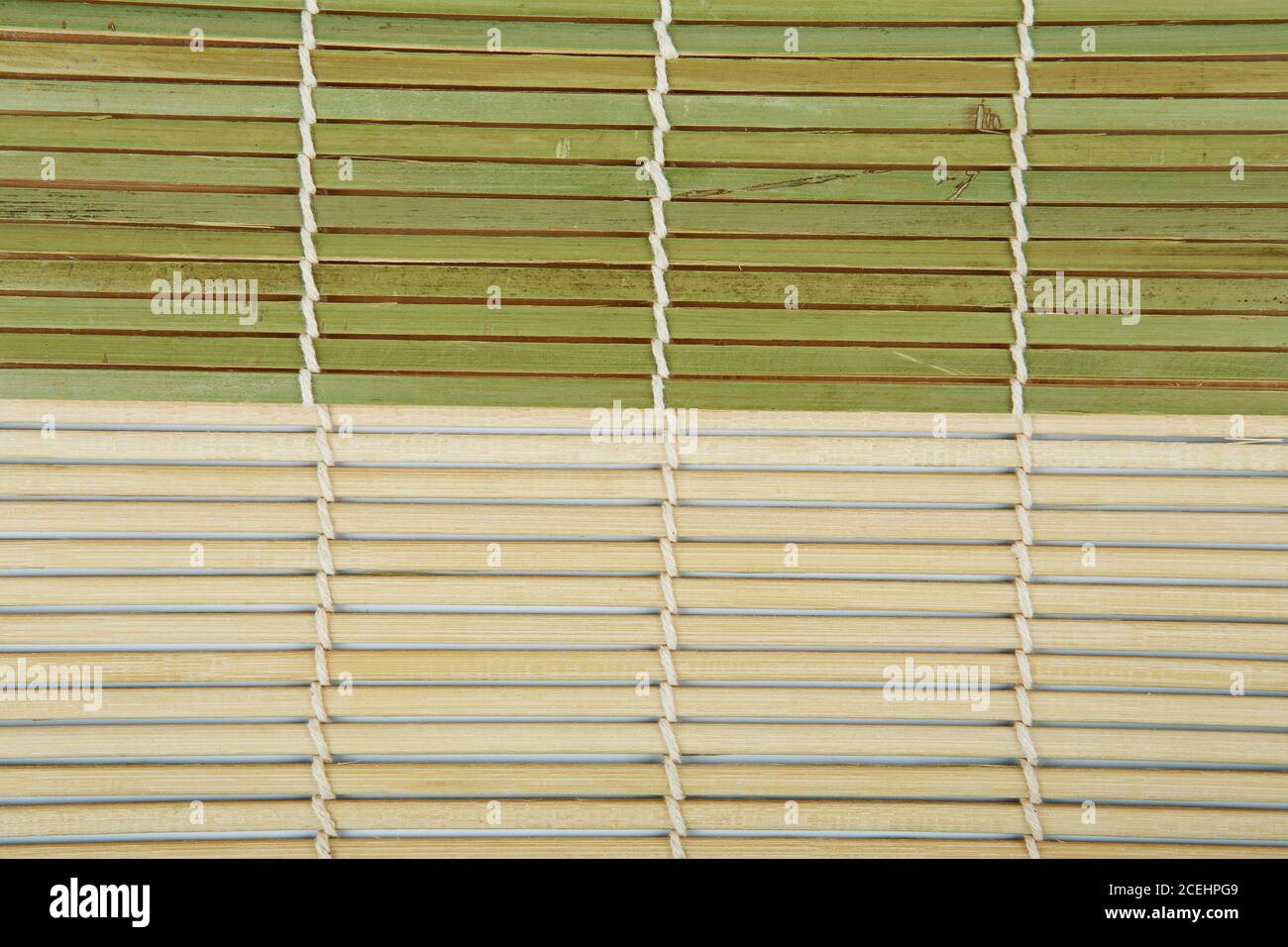 Green Bamboo mat. Traditional green bamboo pad texture. sushi matt background abstract texture. Macro fragment of bamboo mat for making sushi Stock Photo