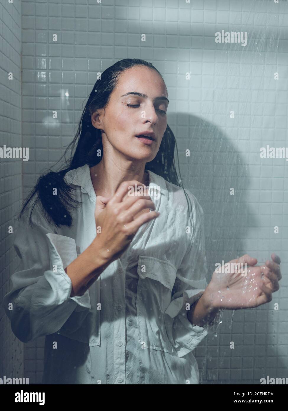 Woman Dressed Wet In The Shower Stock Photo Alamy