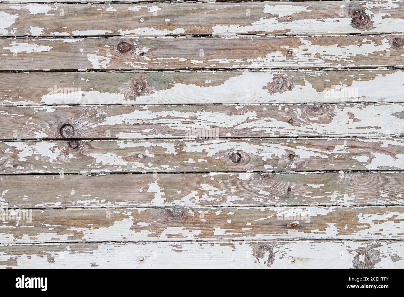 Cracking and peeling white paint on a wall. Vintage wood background with  peeling paint. Old board with Irradiated paint Stock Photo - Alamy