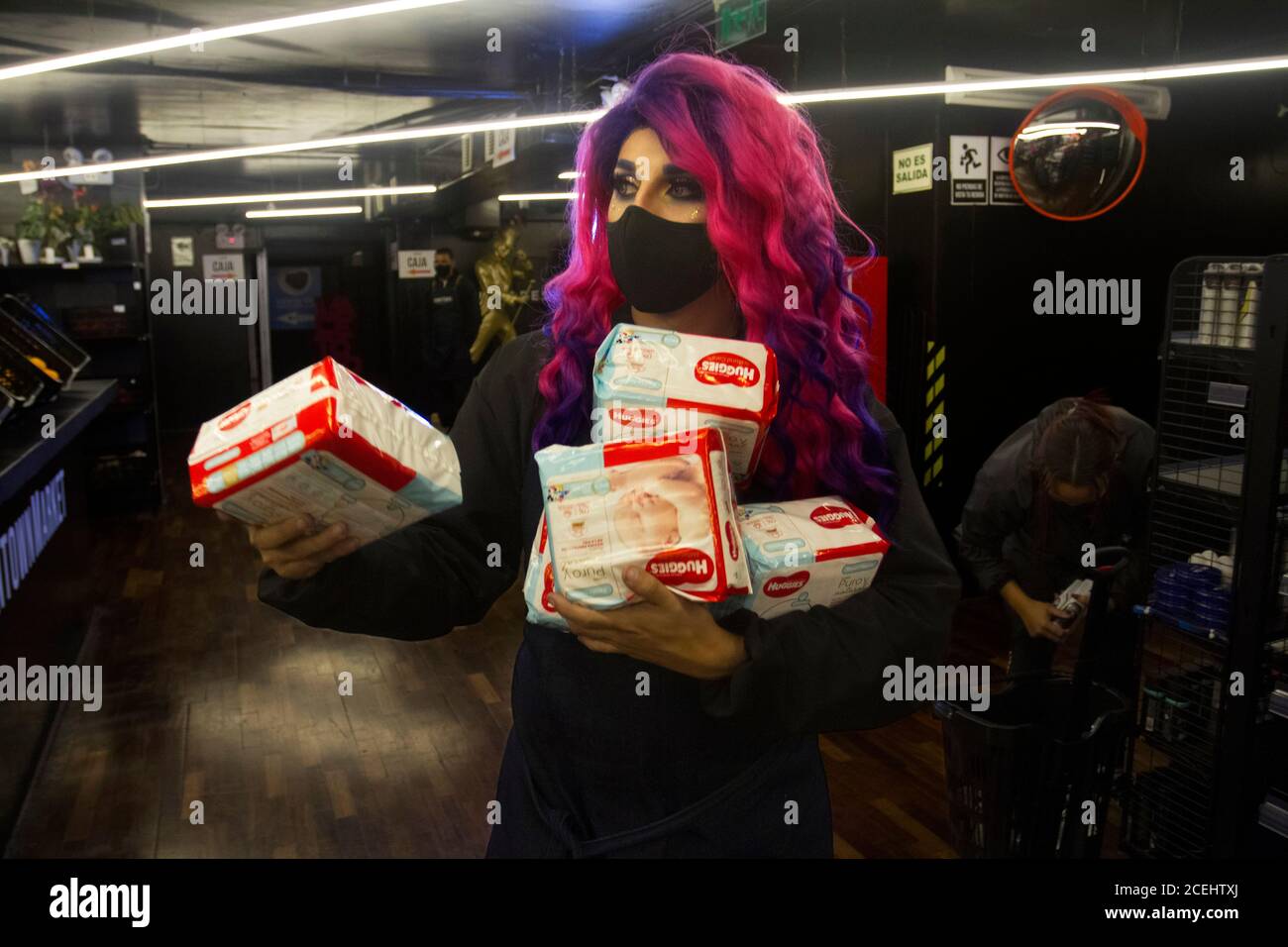 Andrés (a.k.a Uriel The Drag) works as a grocery store employee at Downtown Market. He restocks shelves and welcomes customers. In Peru 647,166 people have been infected and 28,788 have died because of Covid-19 as of August 31, 2020. Stock Photo