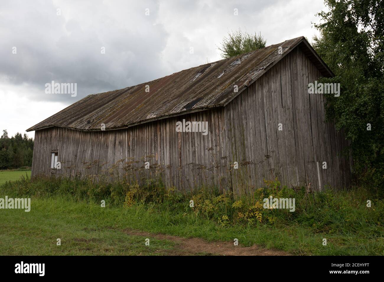 Old dilapidated barn or granary in rural countryside of Hauho, Finland Stock Photo