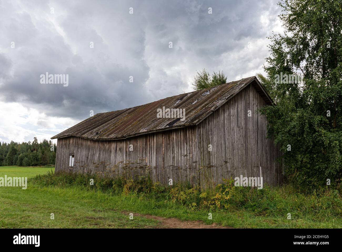 Old weathered and dilapidated barn in rural countryside of Hauho, Finland Stock Photo
