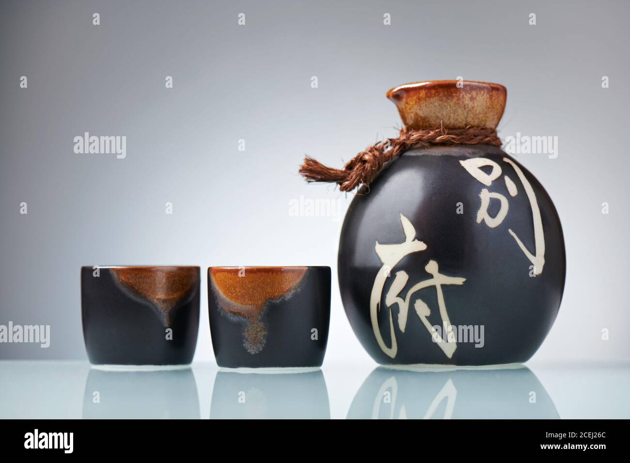 Japanese Sake set from a bottle and two shot glasses Stock Photo Alamy