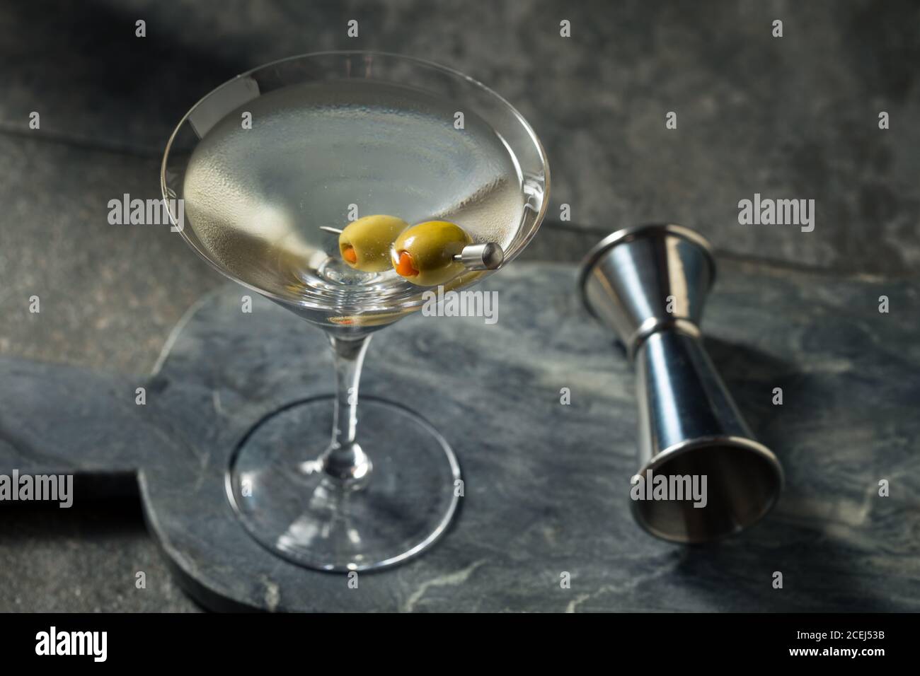 Boozy Dry Vodka Martini with Green Olives Stock Photo Alamy