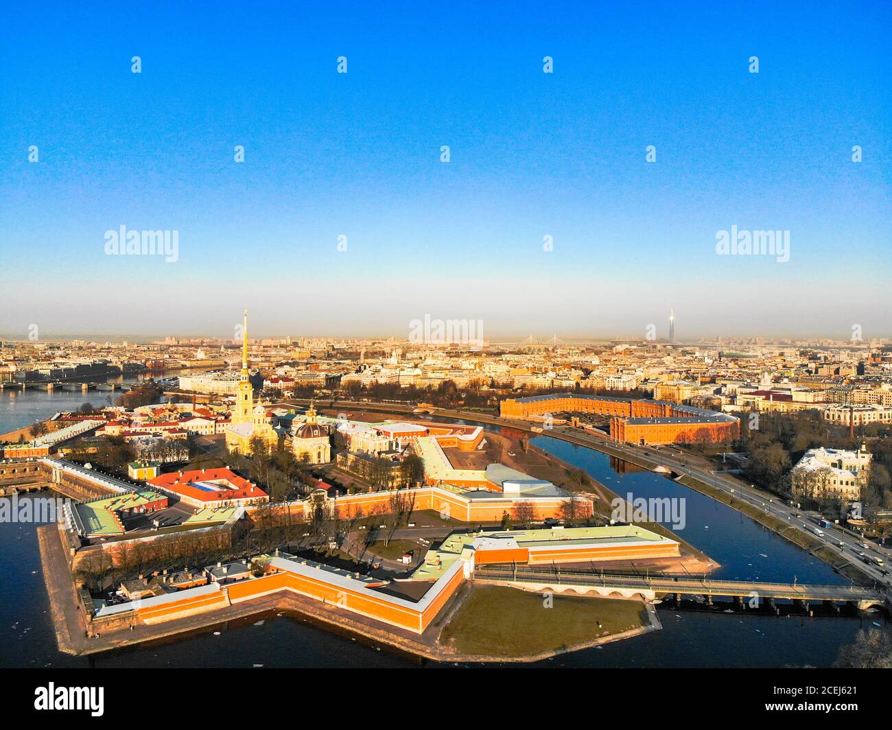 Beautifull aerial view of the Petropavlovsky fortress in sunny spring day. Golden tall spire of famous Peter and Paul Cathedral on the blue sky Stock Photo