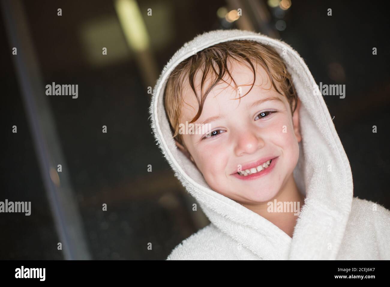 Portrait of caucasian boy in bathrobe Stock Photo Alamy