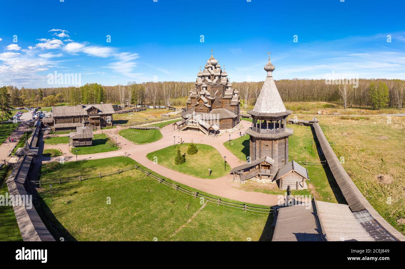 Beautiful Aerial view to traditional Russian village with orthodox wooden chapel and bell tower in Bogoslovka manor. Pokrovskaya multi domed church Stock Photo