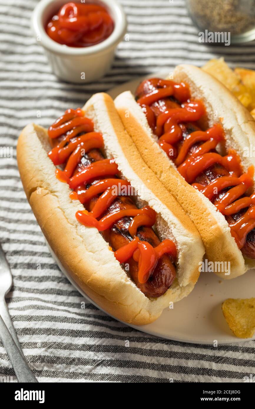 American Hot Dog with Ketchup with Potato Chips Stock Photo Alamy