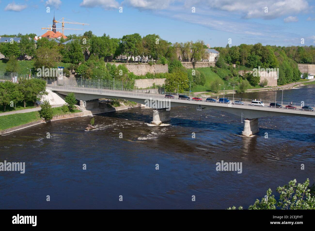 Bridge of Friendship with pedestrian tunnel over Narova River between Narva in Estonia and Ivangorod in Russia. Stock Photo