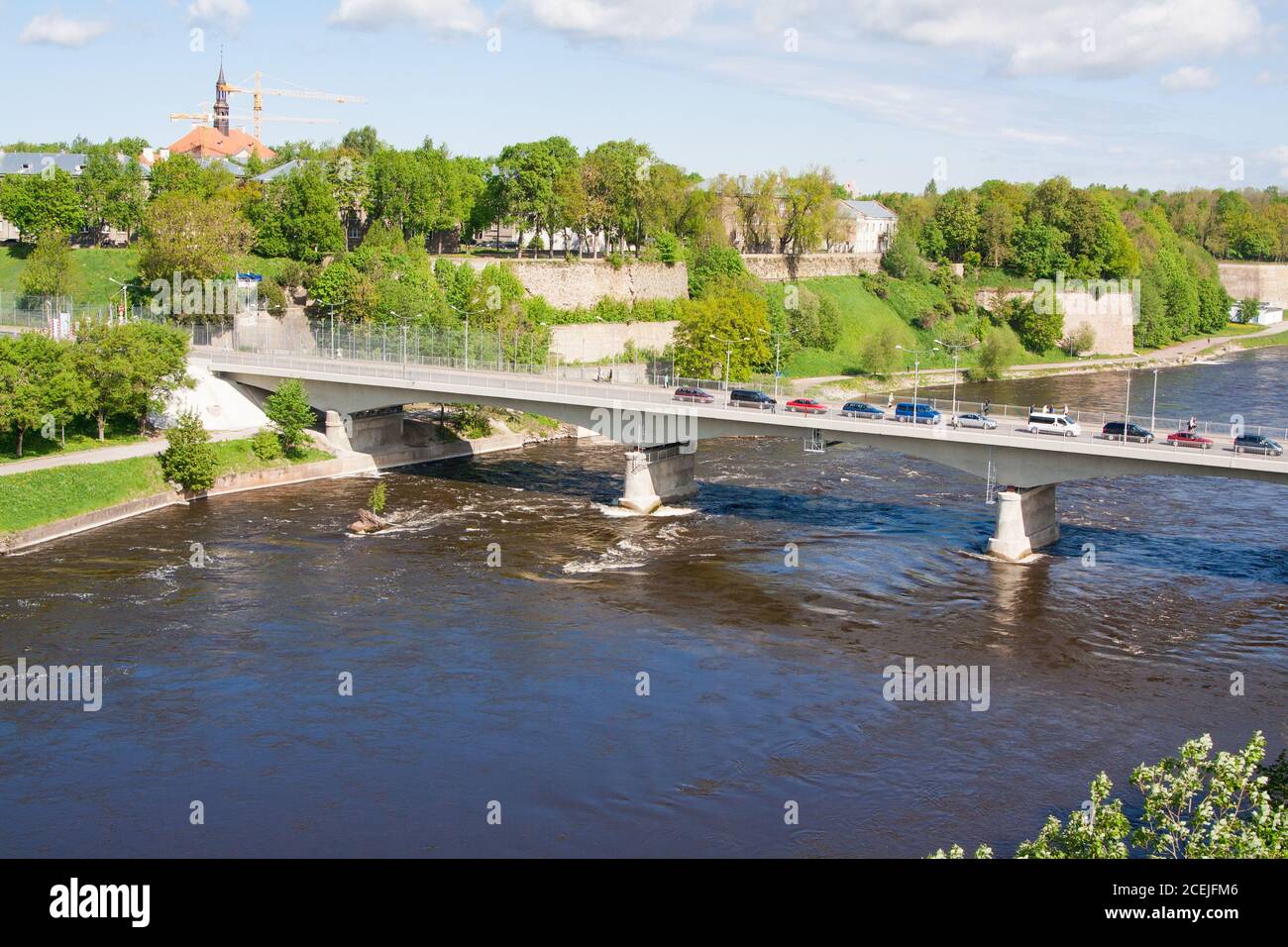 Bridge of Friendship with pedestrian tunnel over Narova River between Narva in Estonia and Ivangorod in Russia. Stock Photo