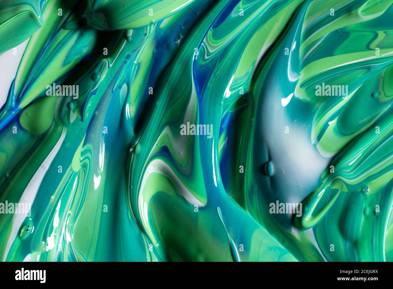 Mix of green and blue paint Stock Photo - Alamy