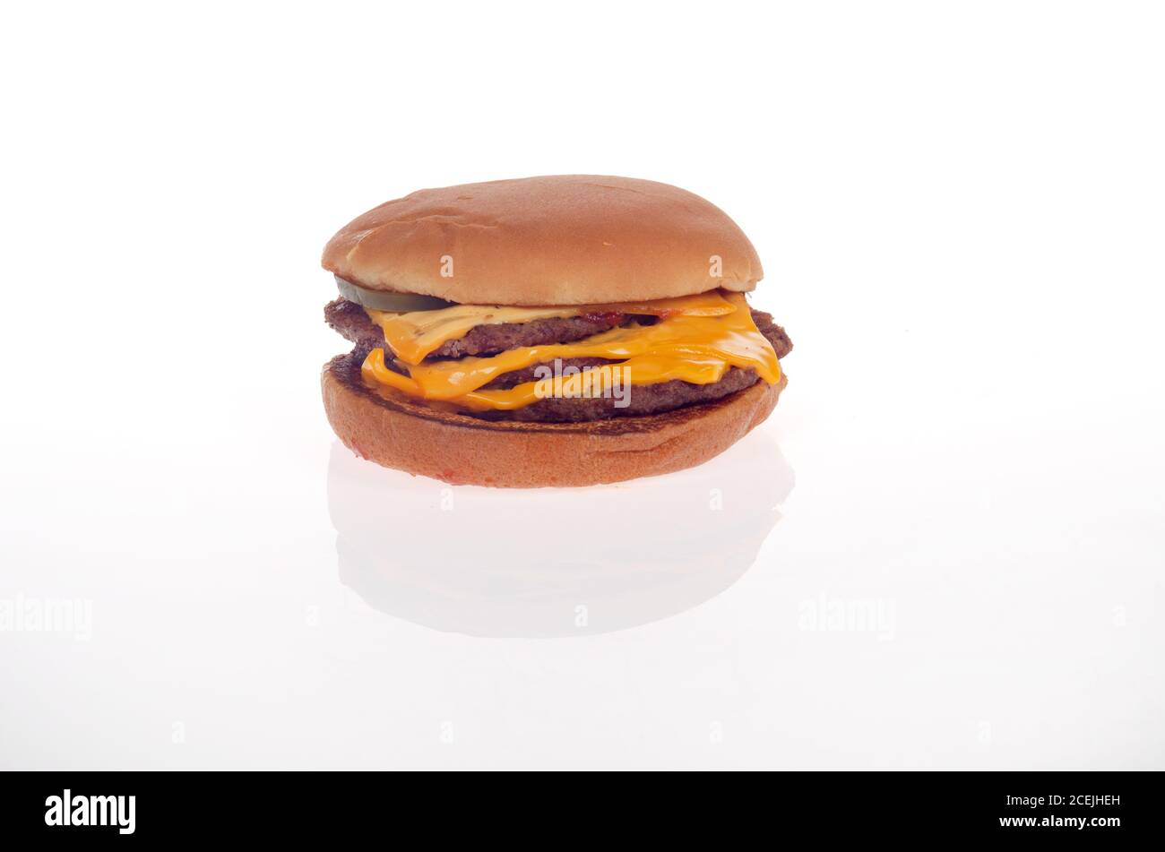 McDonald’s triple cheeseburger on white Stock Photo