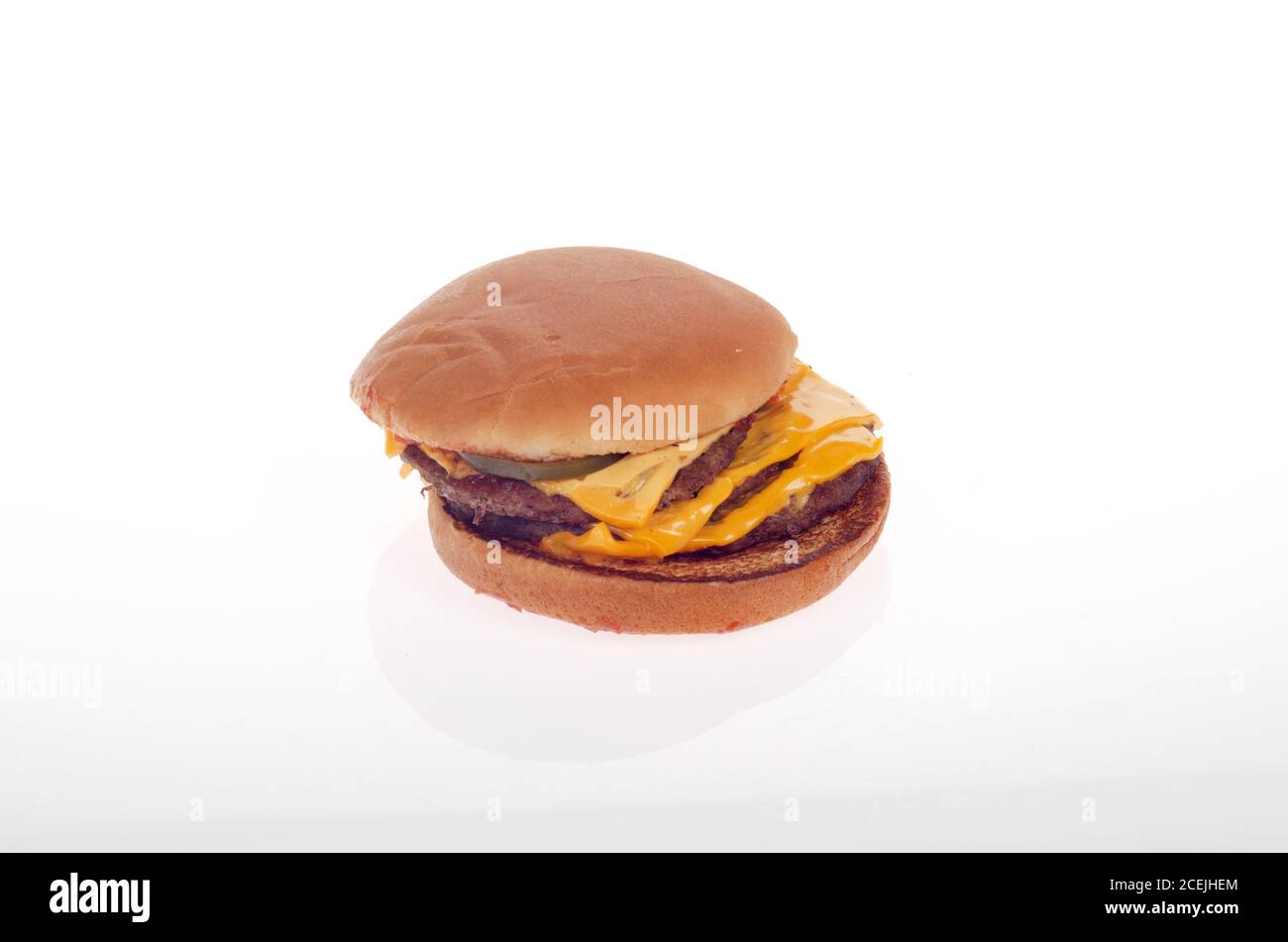 McDonald’s triple cheeseburger on white Stock Photo