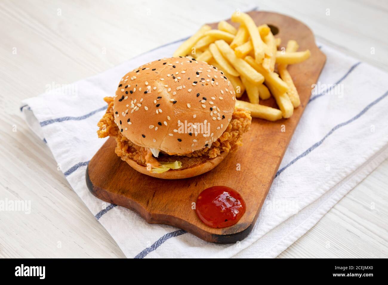 Homemade Chicken Strips Burger with French Fries and soursweet sauce