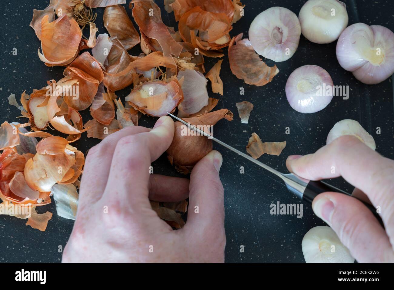 Peeling onion skin knife hand hi-res stock photography and images - Alamy