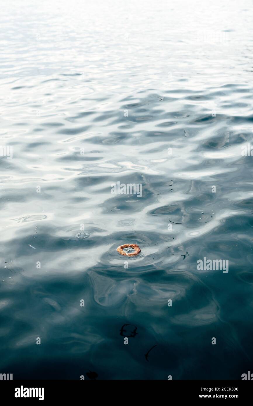 Small ring object floating on surface of rippling sea water in Istanbul Stock Photo