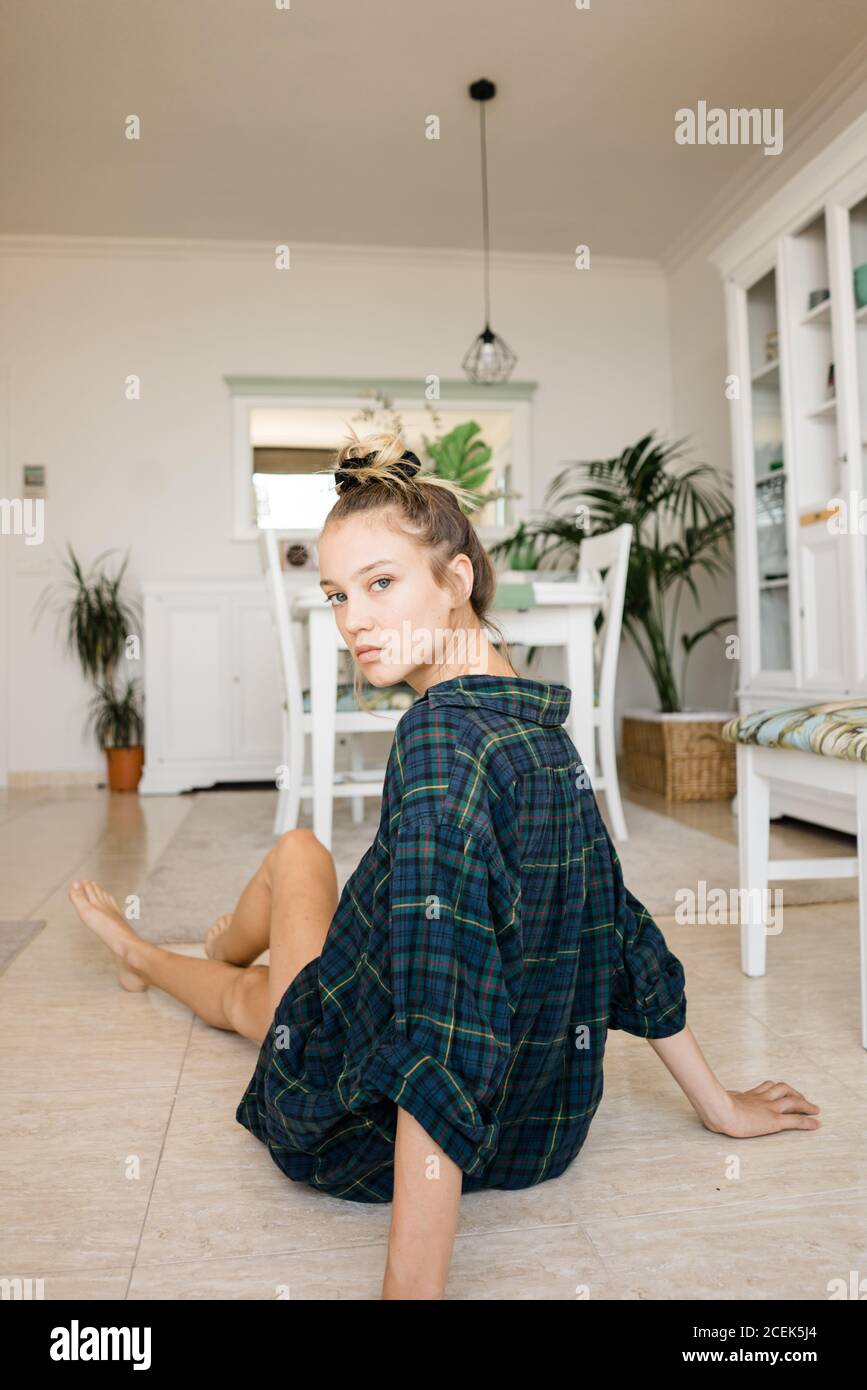 Female sitting on floor hi-res stock photography and images - Alamy