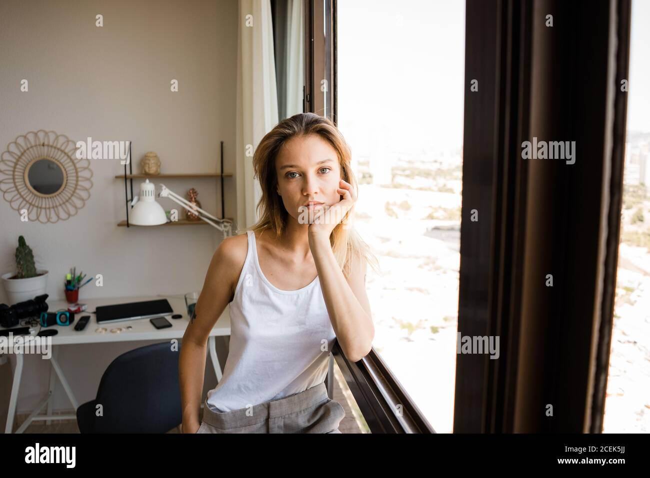 Young blonde woman posing near hi-res stock photography and images - Alamy