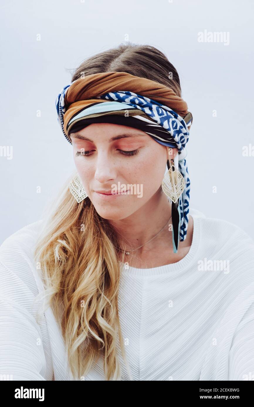 Beautiful Woman with kerchief on head looking at camera Stock Photo