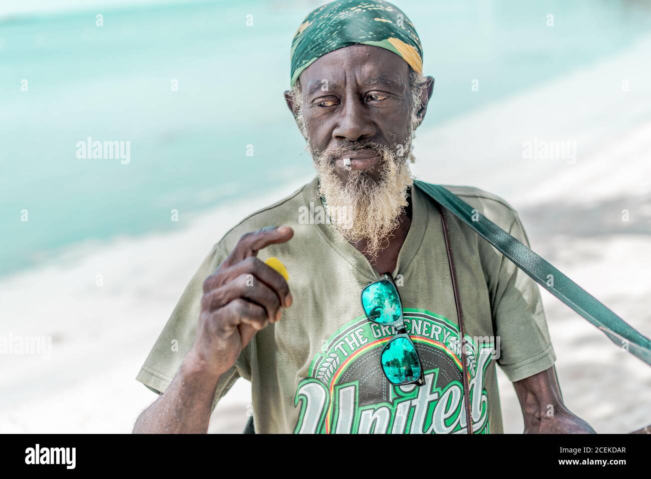 Jamaican man playing guitar Stock Photo