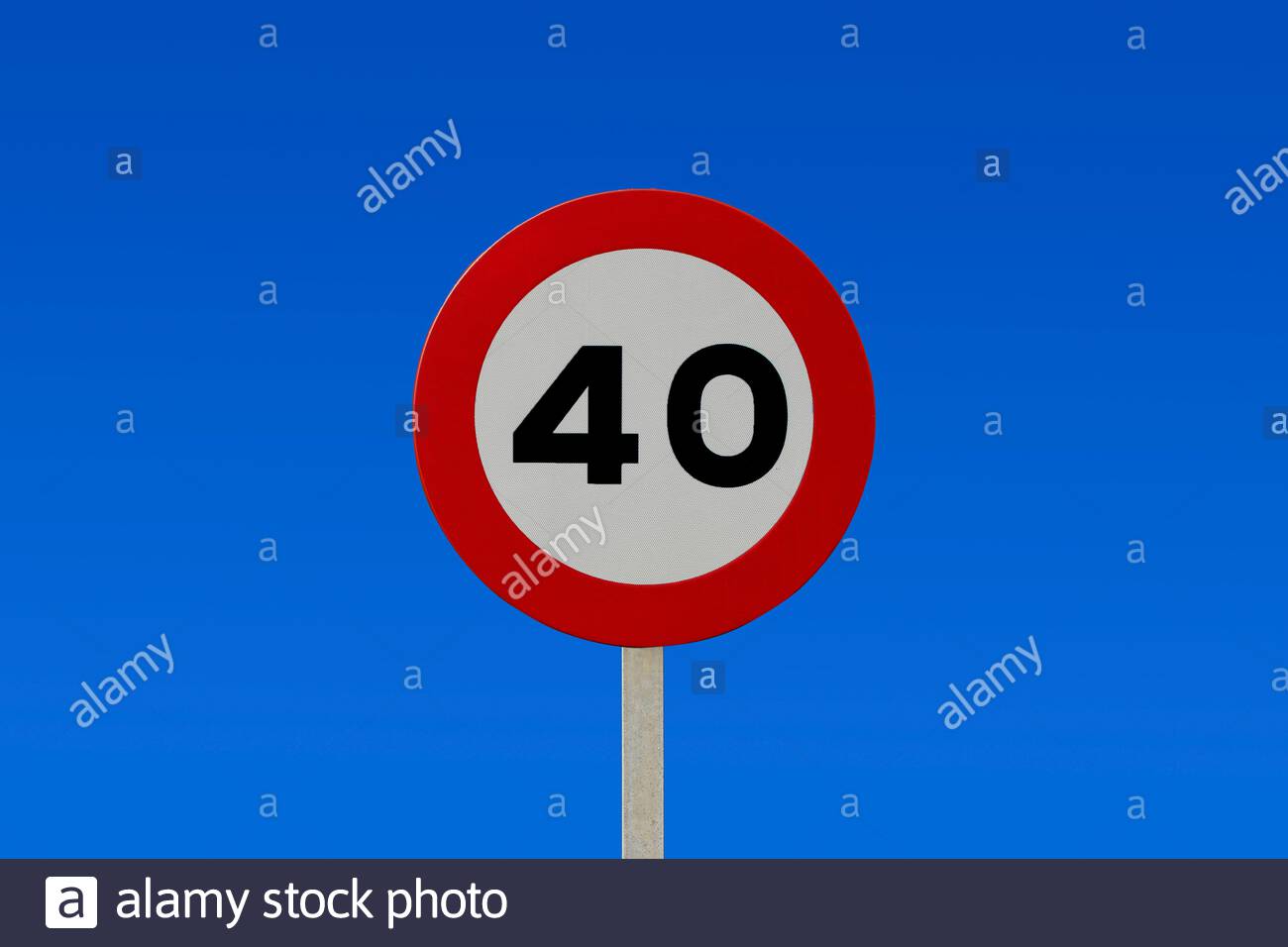Traffic signs against blue sky - 40km / h speed limit sign with a blue sky in the background Stock Photo