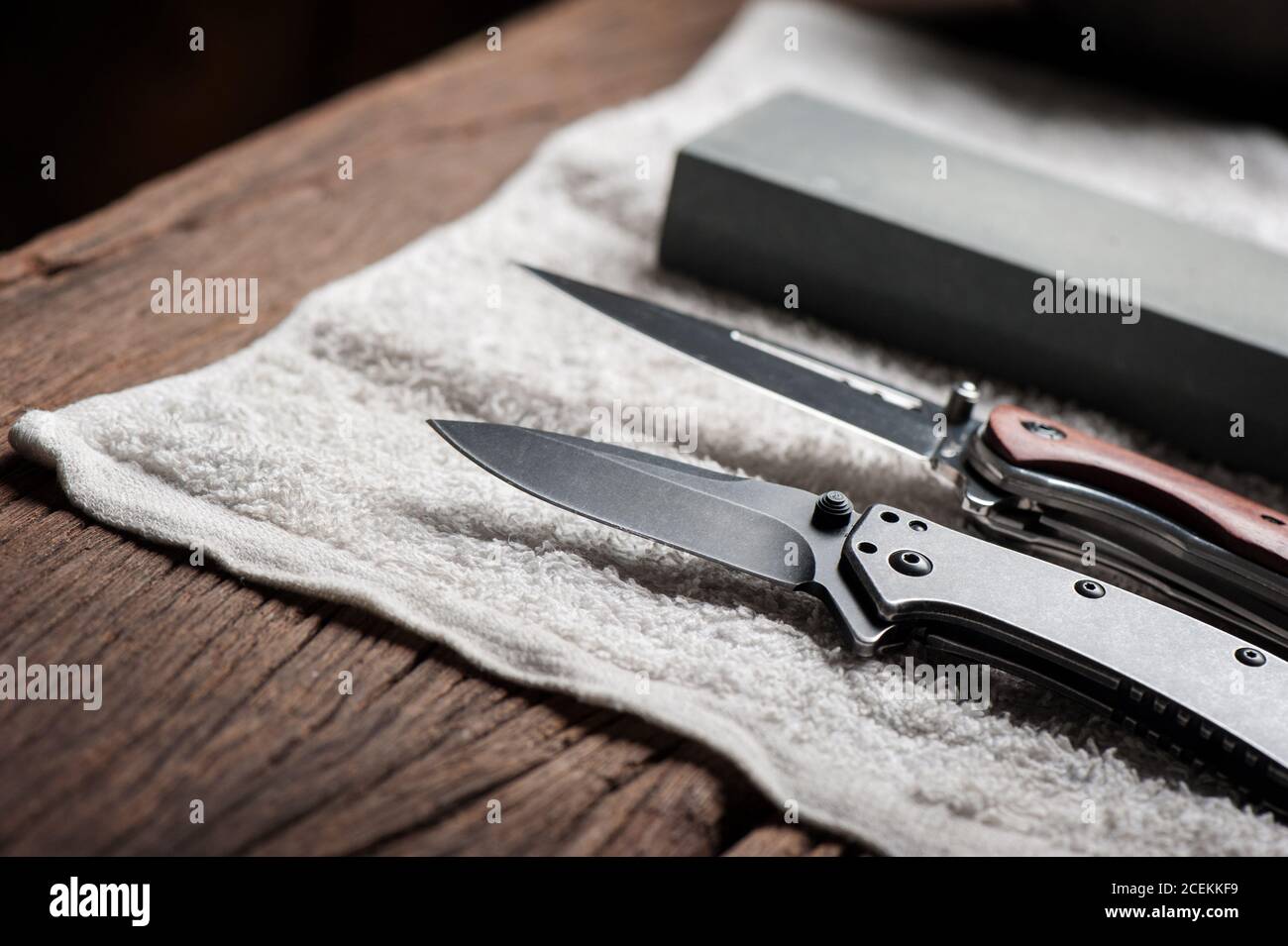 Premium Photo  The man using whetstone to sharpening his pocket knife  pocket knife care and maintenance concept