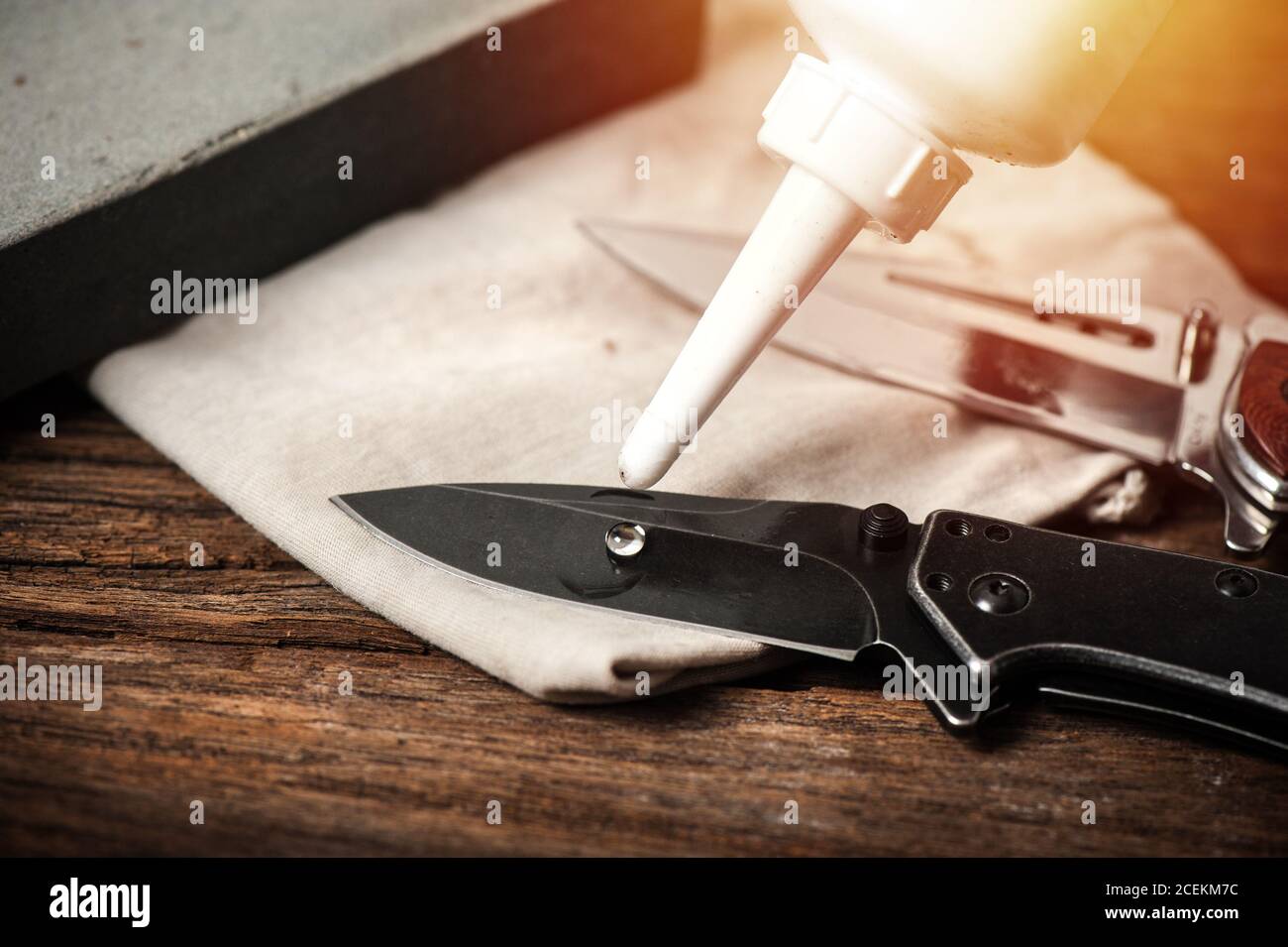 The man oiling his pocket knife. Pocket knife care and maintenance