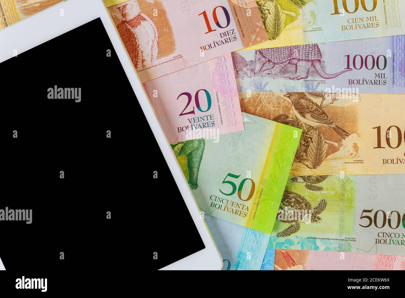 Digital tablet computer with Venezuelan Bolivar banknote with Venezuela