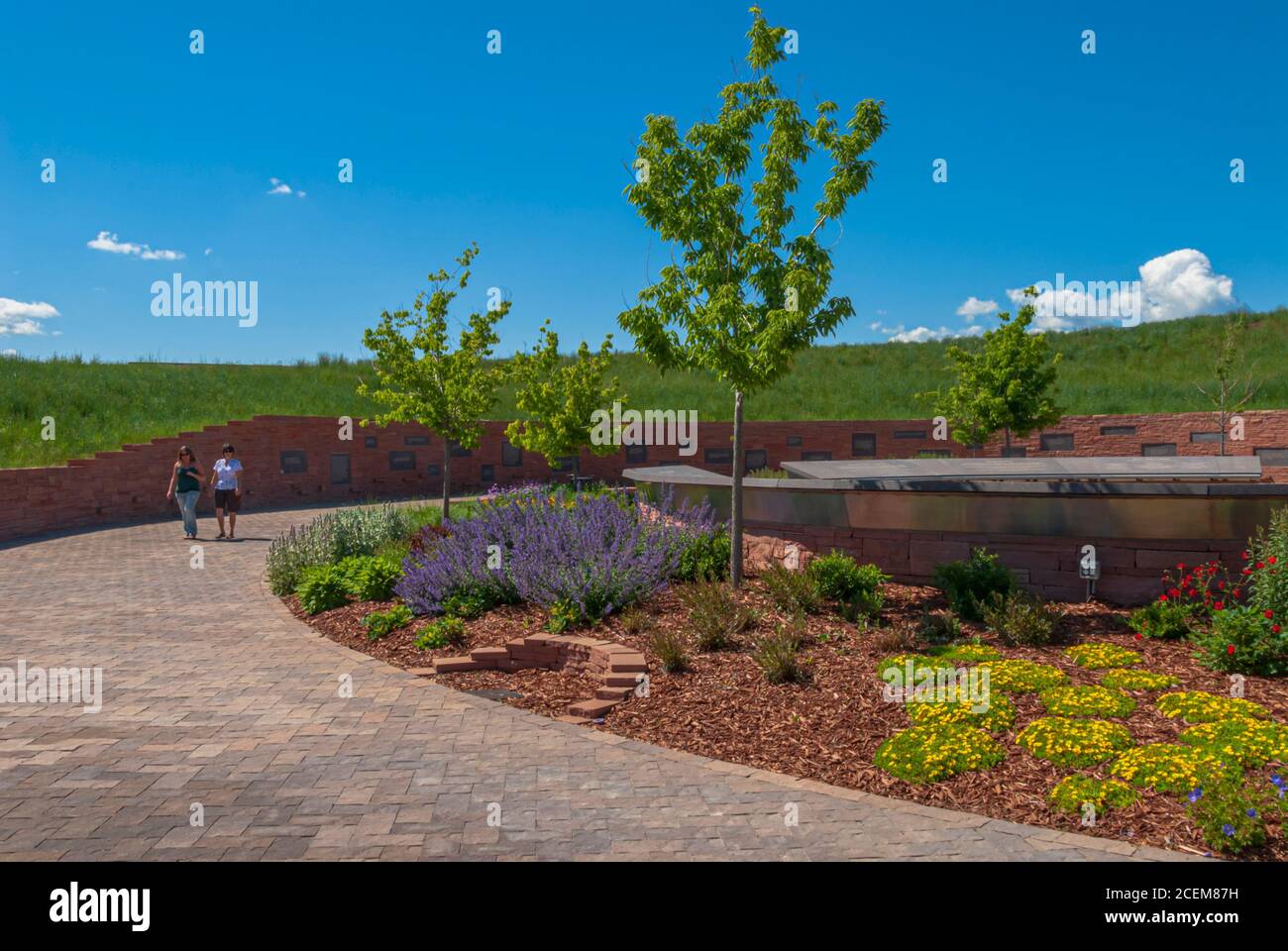 Visitors walk around the beautiful Columbine Memorial, Littleton Colorado USA. Photo taken in June. Stock Photo