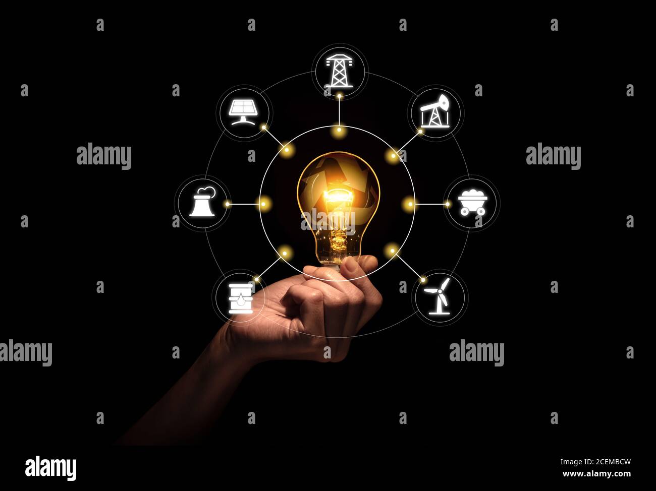 Hand holding light bulb with recycle symbol inside against with icons energy sources for renewable, sustainable development. Stock Photo