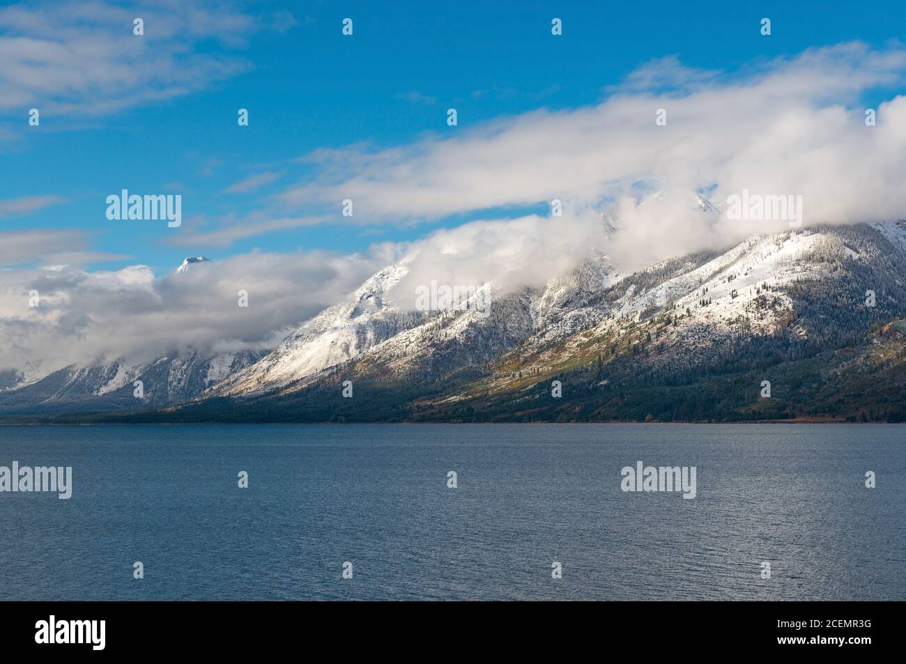 Early morning reflection of the Grand Teton Range with snow in Jackson