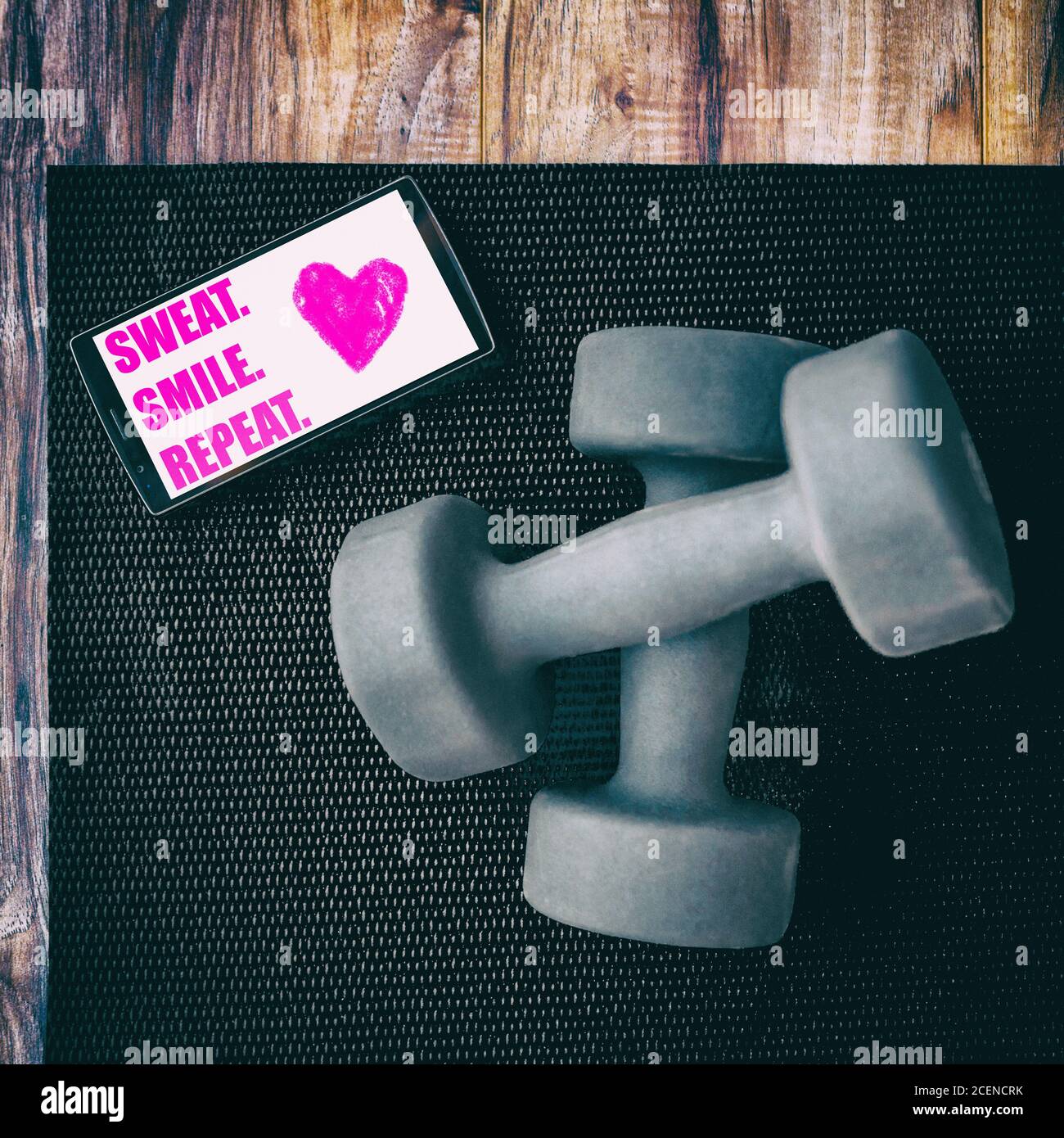 Gym fitness motivation quote SWEAT SMILE REPEAT photo for instagram social media. Positive inspirational quotes to motivate to exercise written on Stock Photo