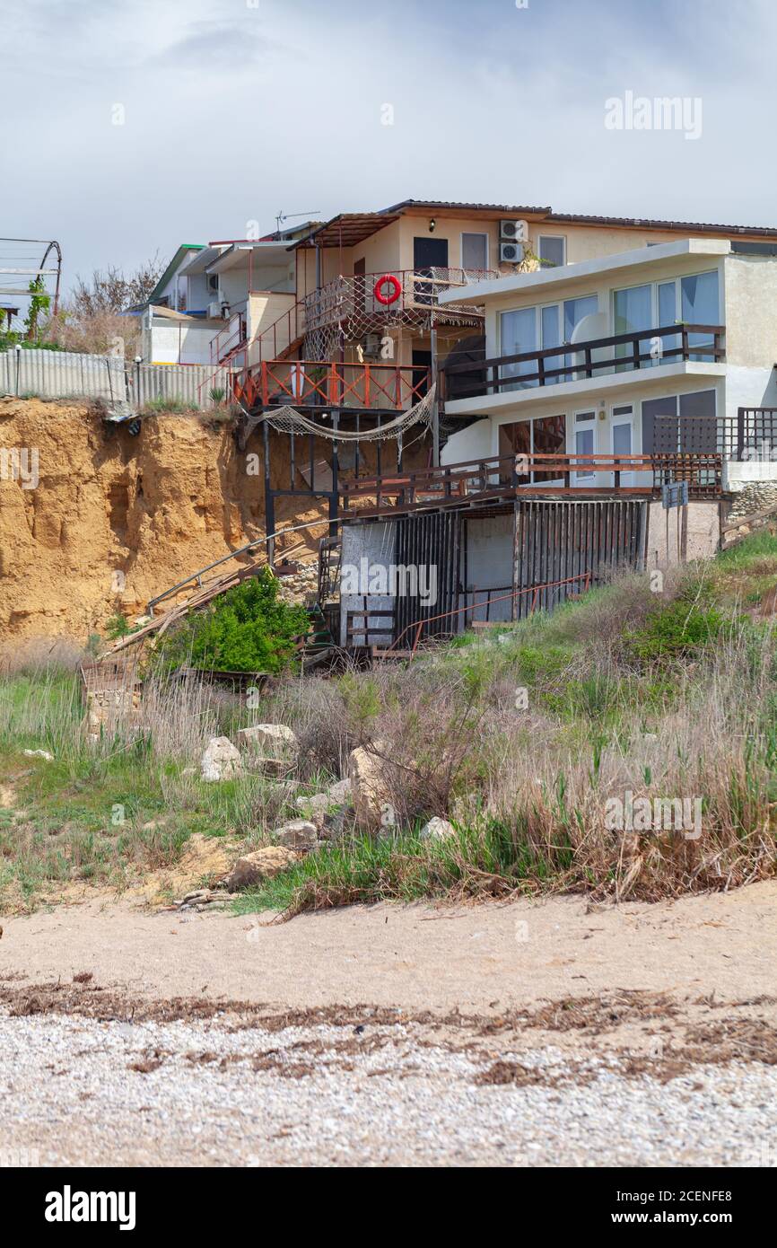 Coastal guest houses at Lyubimovka beach. Summer landscape, vertical photo of Black Sea coast, Crimea Stock Photo