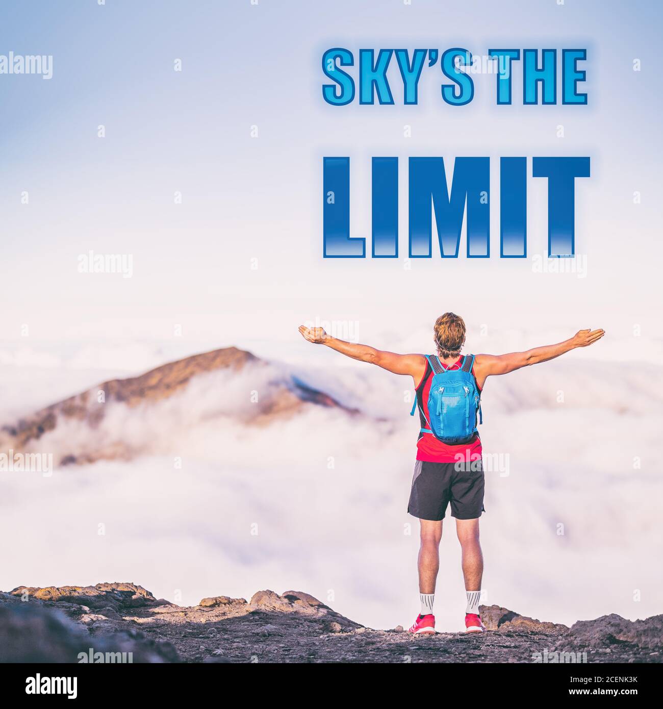 SKY'S THE LIMIT motivation quote on adventure lifestyle background written on sky copy space. Man with open arms in happiness and freedom active Stock Photo