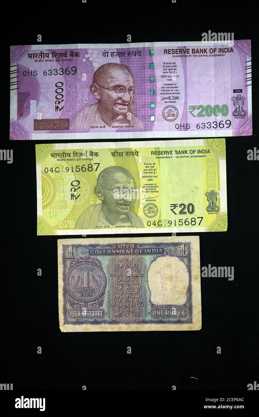 Indian Money with 2021 new year concept on black background. Concept of New Year 2021 with Indian currency. Indian currencies on black background. Stock Photo