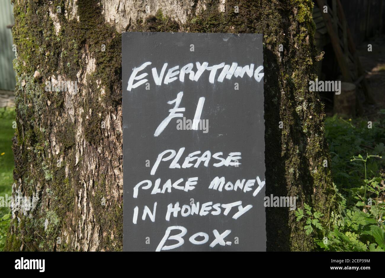 'Everything £1 Please Place Money in Honesty Box' Sign Outside a Shop in the Village of Simonsbath within Exmoor National Park, Somerset, England, UK Stock Photo