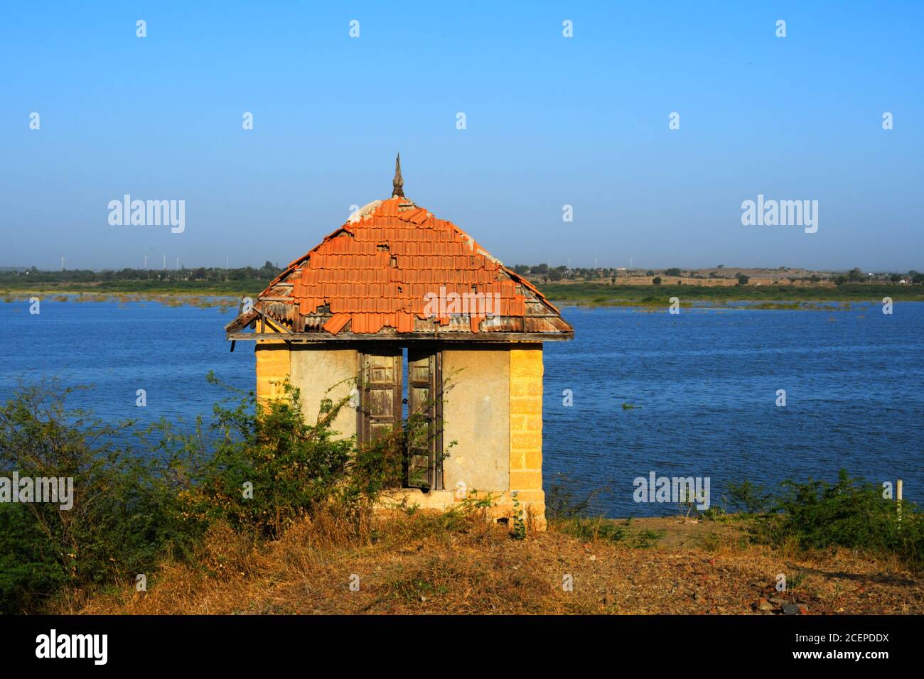 Hut on banks of the river of India, old hut, Little old house on banks of the river at sunset in silence Stock Photo