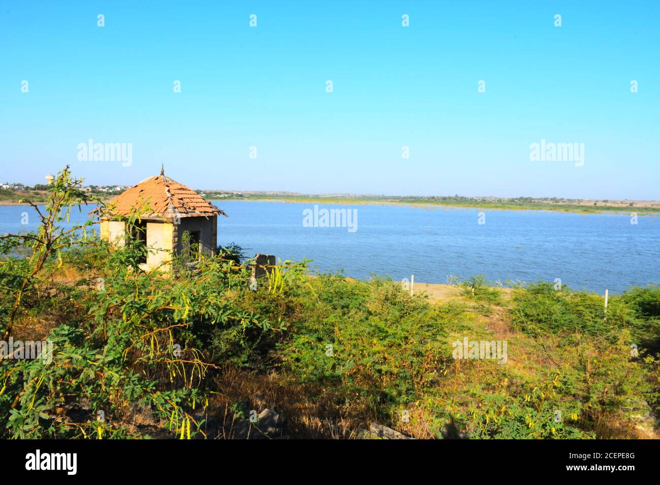 Hut on banks of the river of India, old hut, Little old house on banks of the river at sunset in silence Stock Photo