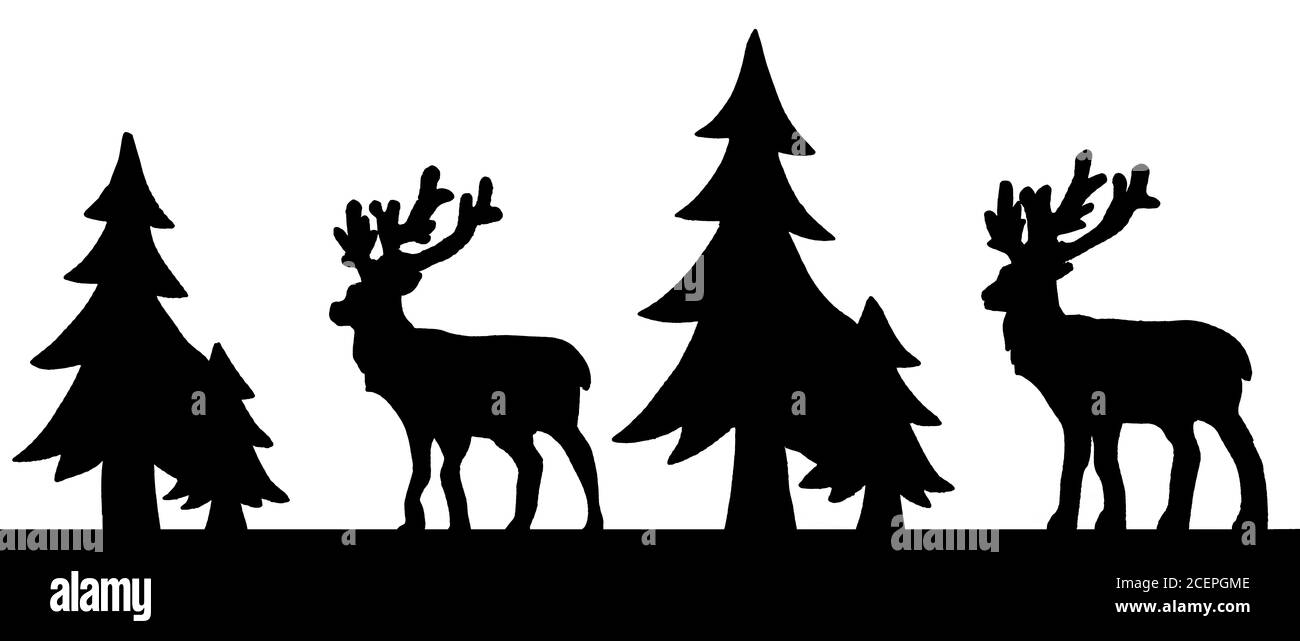 Cut out deer figure made of wood with dark edges and wooden fir trees isolated on white Stock Photo