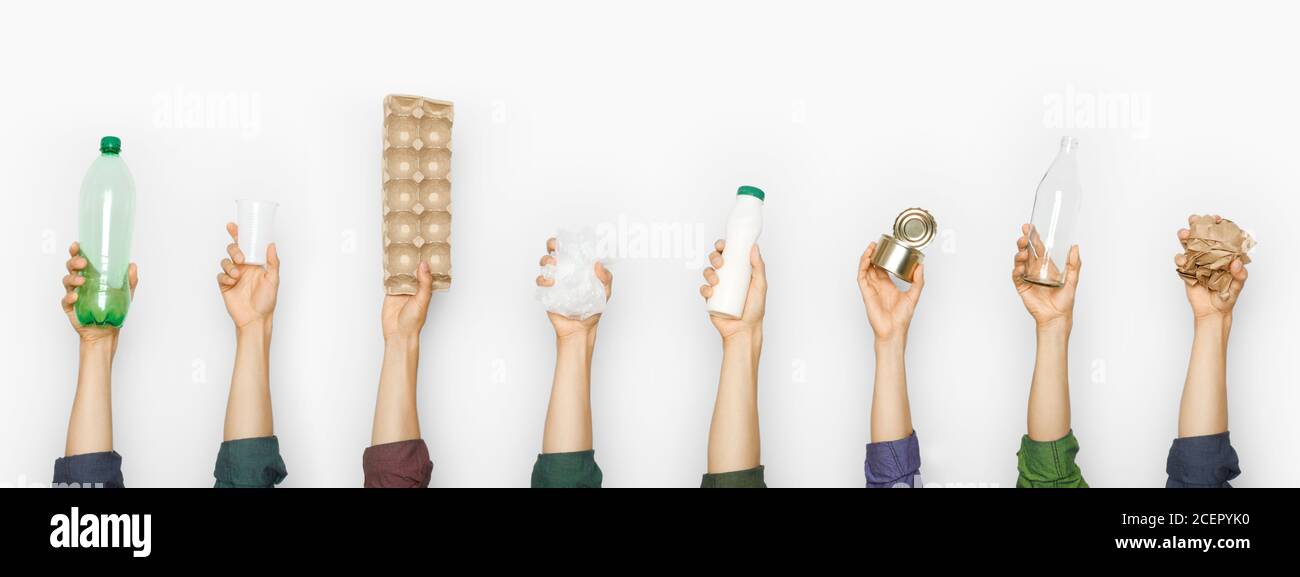 Different types of garbage in human hands. Stock Photo