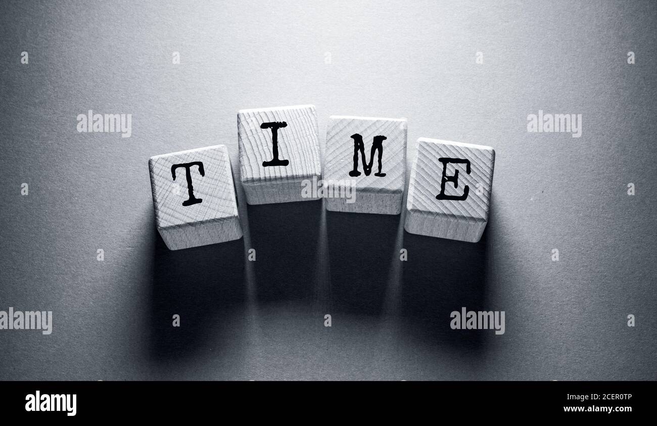 Time Word Written on Wooden Cubes Stock Photo