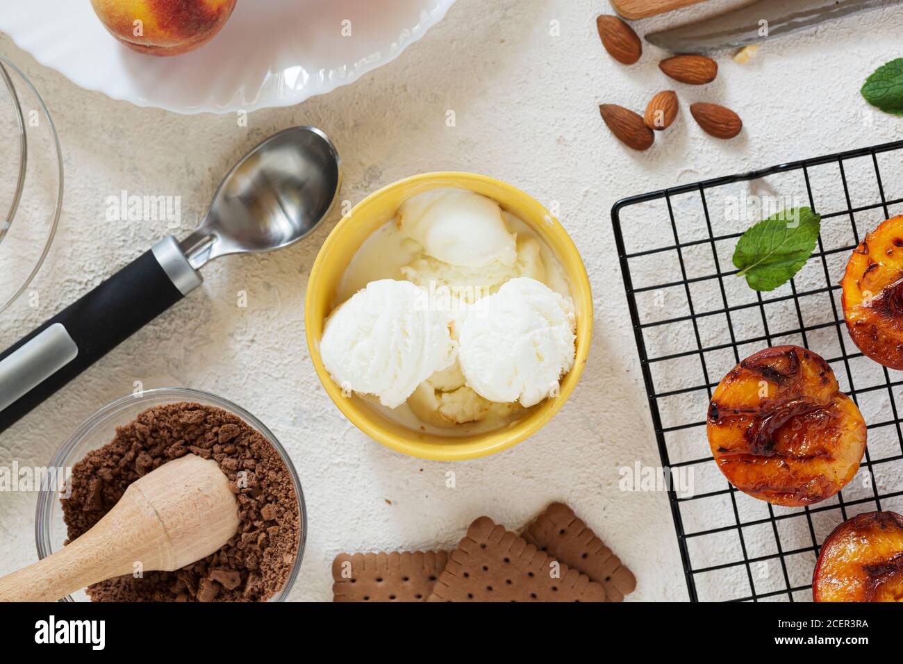 Grilled peaches summer dessert American bbq. Served with almonds, ice